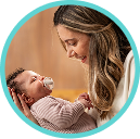 [Translate to Czech (Reborn):] Mother with Baby and soother