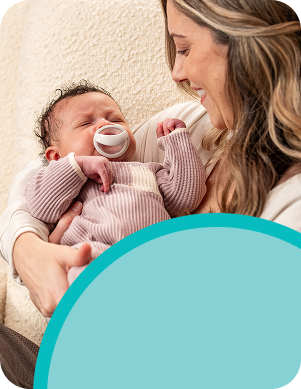 [Translate to Czech (Reborn):] Mother with Baby and soother