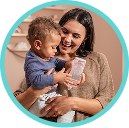 [Translate to Czech (Reborn) nuk.cz:] Mother with Baby and Learner Bottle