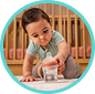 [Translate to Czech (Reborn):] Baby with Learner Bottle