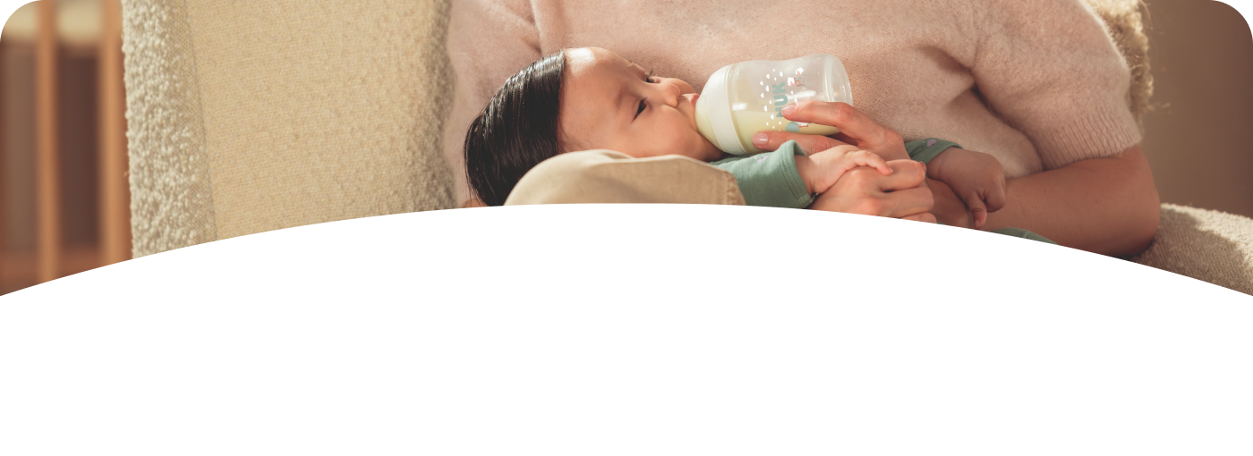 [Translate to Czech (Reborn) nuk.cz:] Mother with Baby and Baby bottle