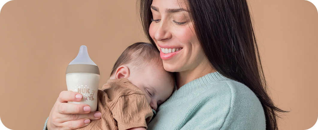 [Translate to Czech (Reborn):] Mother with Baby and Baby bottle