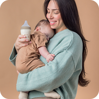 [Translate to Czech (Reborn):] Mother with Baby and Baby bottle