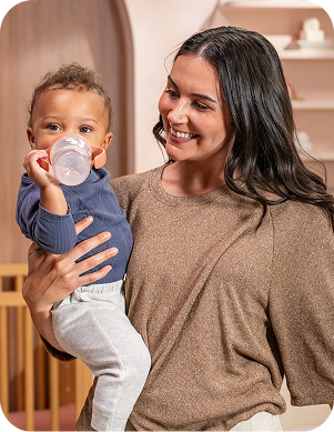 [Translate to Czech (Reborn):] Mother with Baby and Learner bottle