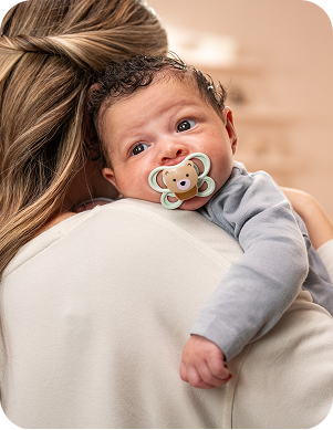 [Translate to Czech (Reborn):] Baby with soother