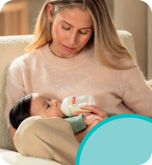 [Translate to Czech (Reborn):] Mother with Baby and Baby bottle