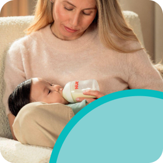[Translate to Czech (Reborn):] Mother with Baby and Baby bottle